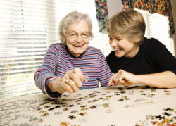 an elderly woman and a caregiver